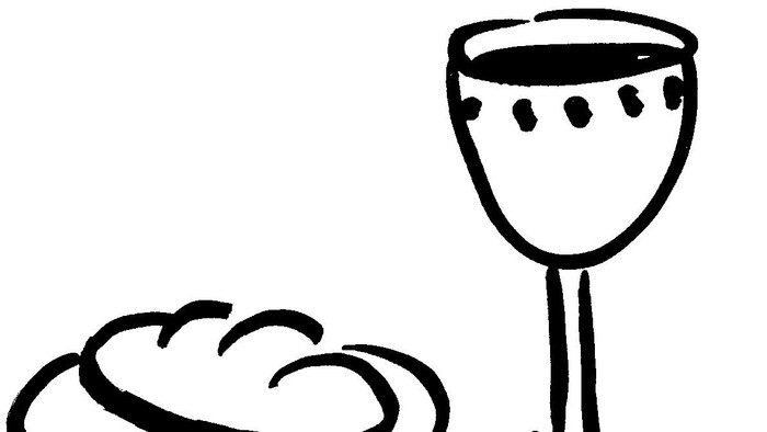 Ein Glas und ein Stück Brot