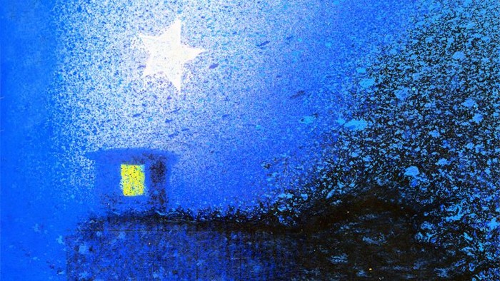 Ein helles Sternsymbol strahlt in der Dunkelheit, umgeben von blauem Licht.