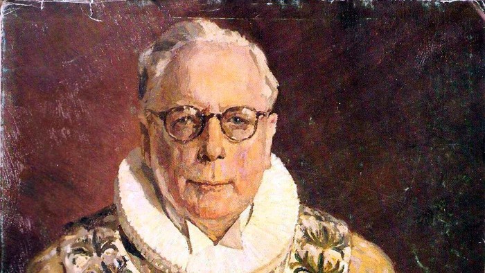 Portræt af en ældre mand med briller og hvid krage.