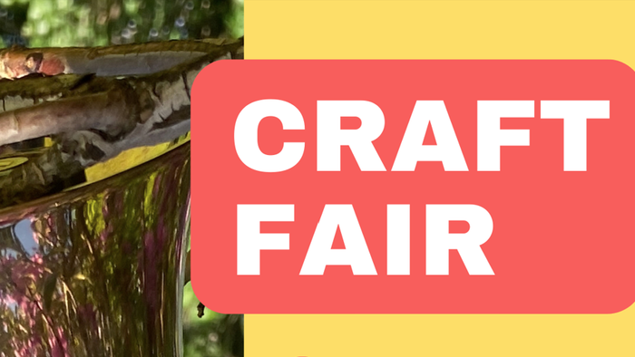 A close-up of a wooden craft project at a craft fair