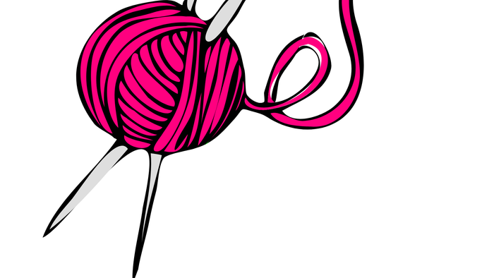 En rød trådske og kniven stikker ud af den