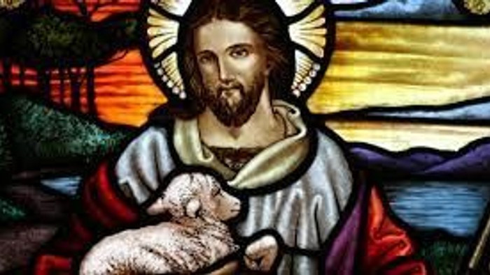 Billedet viser Jesus med barn i en farverig glassmaleri-stil.