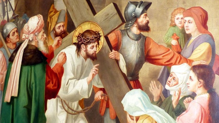 Jesus trägt das Kreuz, umgeben von Menschen in traditioneller Kleidung