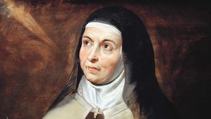 Ein Porträt einer Nonne mit schwarzer Haube und weißem Habit.