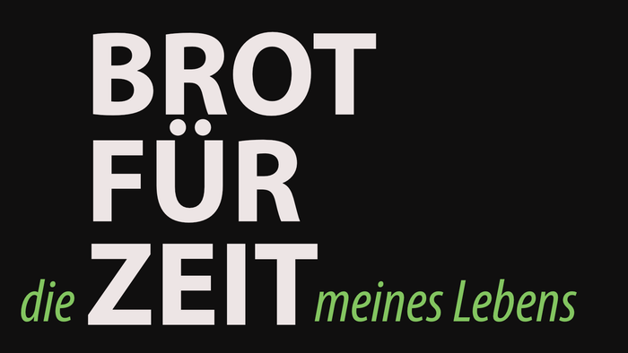 Das Bild zeigt den Satz "Brot für die Zeit meines Lebens" in weißer und grüner Schrift auf schwarzem Hintergrund.