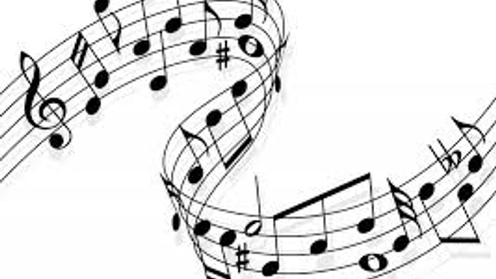 Bogstaver slanger sig på musikpapir.