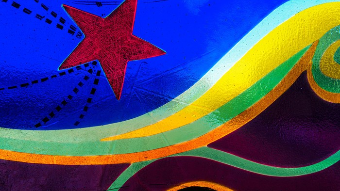 Billedet viser en farverig stjernetegning på blå baggrund.