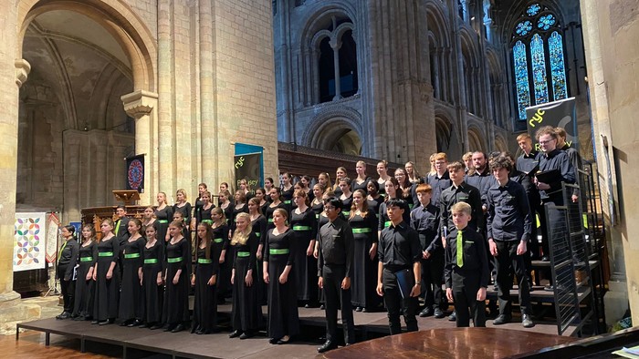 Large choir performing in grand cathedral