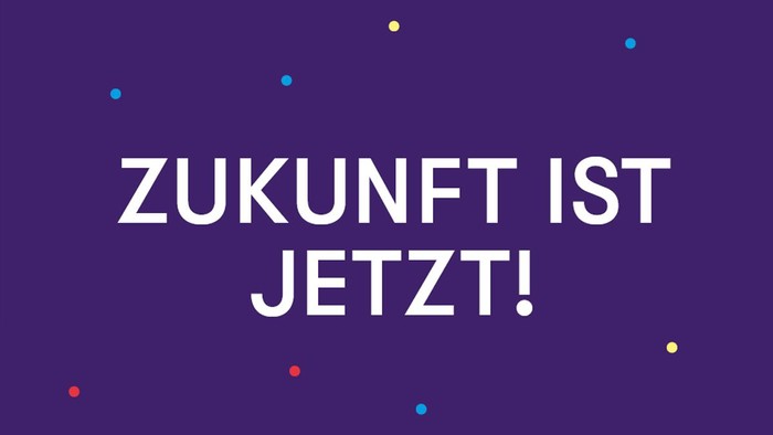 Bild mit bunten Punkten und dem Text "ZUKUNFT IST JETZT!"