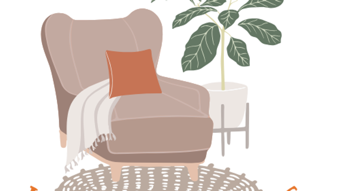 Gemütliches Wohnzimmer mit Sessel, Kissen, Decke und Pflanze