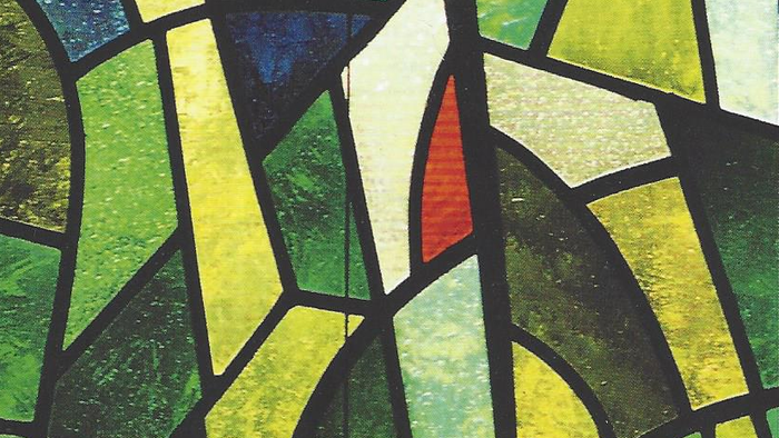 Buntes Mosaik aus Glasstücken in Grün und Gelb