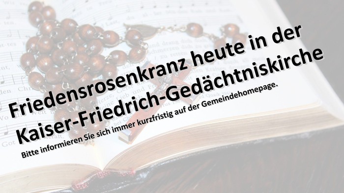 Offenes Buch mit Text in deutscher Sprache und Illustration von Rosen.