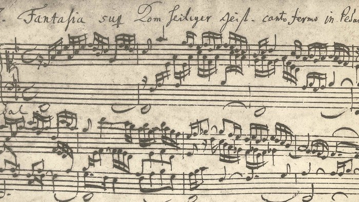 Altes Notenblatt mit handschriftlicher Partitur und Text in Latein.