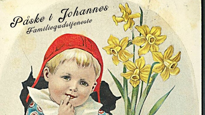 Et barn med rød hue og blomster.