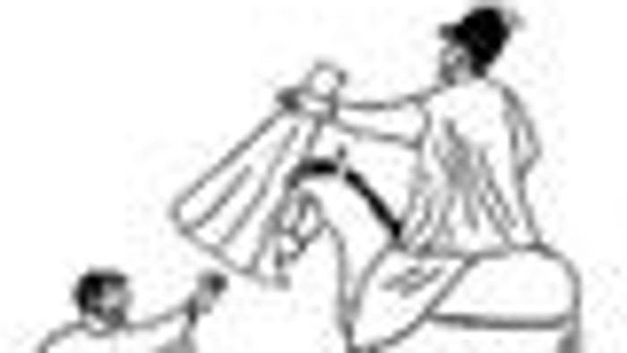 Ein Vogel sitzt auf einem Baumzweig.