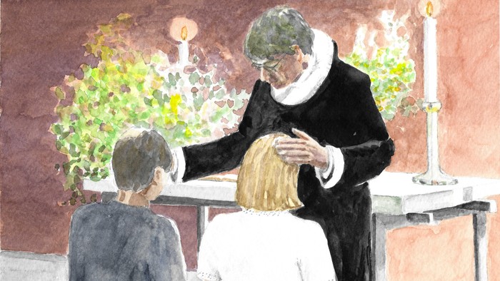 En præst udfører en ritual på et barn i en kirke.