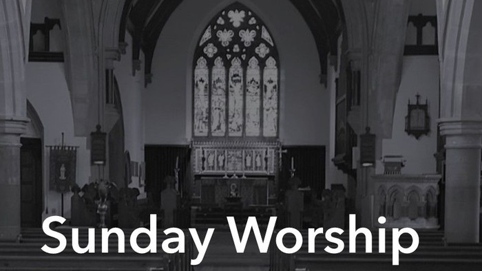 Church interior with pews, stained glass windows, and organ, labeled 