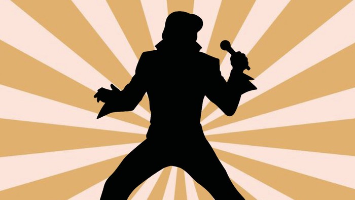 Silhuet af en sanger, der holder en mikrofon, med en strålende baggrund.