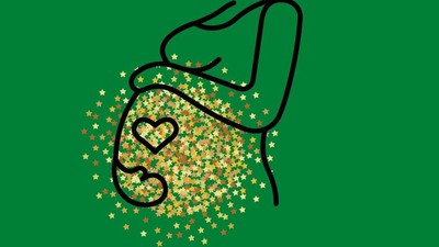 Ein schwarzes Herz mit Sternen auf grünem Hintergrund