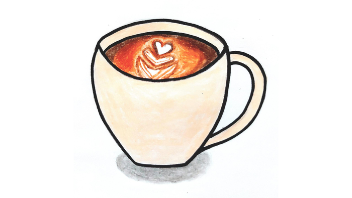 Ein weißer Becher mit Kaffee und Herz-Milchschaum.