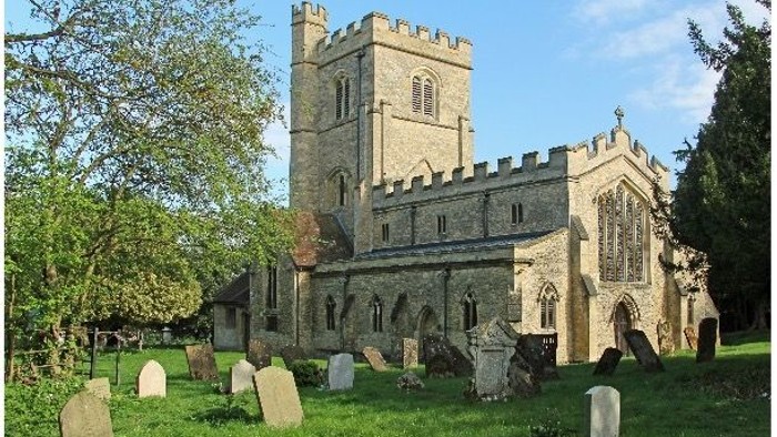 Church with graveyard and trees