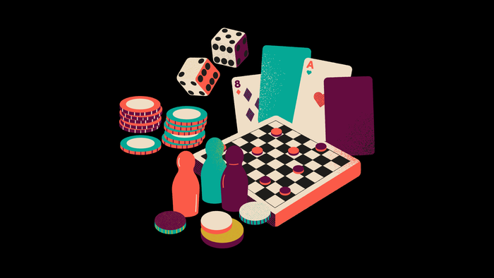 Verschiedene Spielsachen wie Würfel, Karten und Schachbrett auf schwarzem Hintergrund
