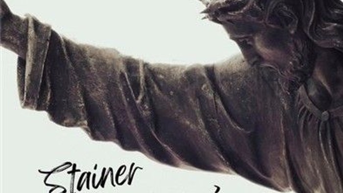 Bronze crucifixion statue with text 