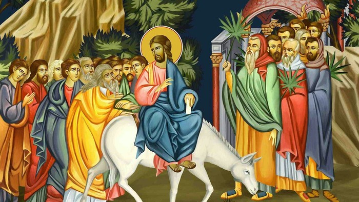 Billedet forestiller en religiøs procession med Jesus på en hvid hest, omgivet af en folkemasse.