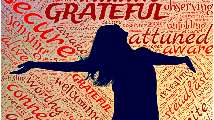 Silhouette of woman with positive words background