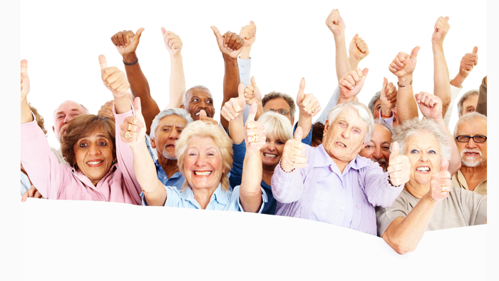 Eine Gruppe älterer Menschen feiert und zeigt nach oben.
