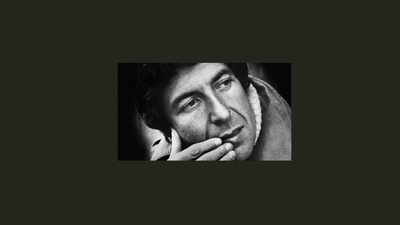 En svart-hvitt portrætbillede af en mand med hånd på kinn.