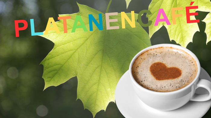 Farbenfroher Kaffee in einer Tasse mit Herz, umgeben von grünen Blättern und dem Text 