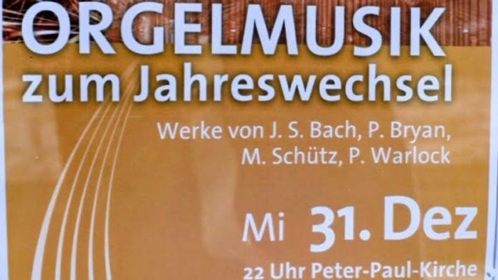 Plakatwerbung für ein Orgelkonzert zu Silvester mit Werken von Bach, Bryan, Schütz und Warlock am 31. Dezember.