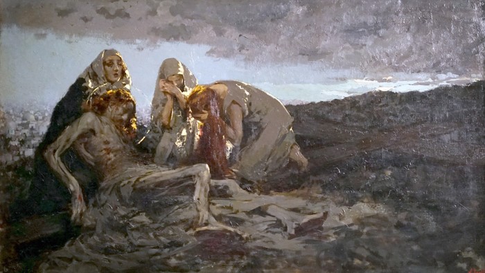 To tre nakne kvinder sidder på en klippe med et hav i baggrunden