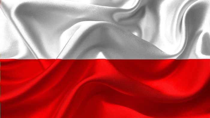 Das Bild zeigt eine flatternde Fahne in Rot und Weiß.