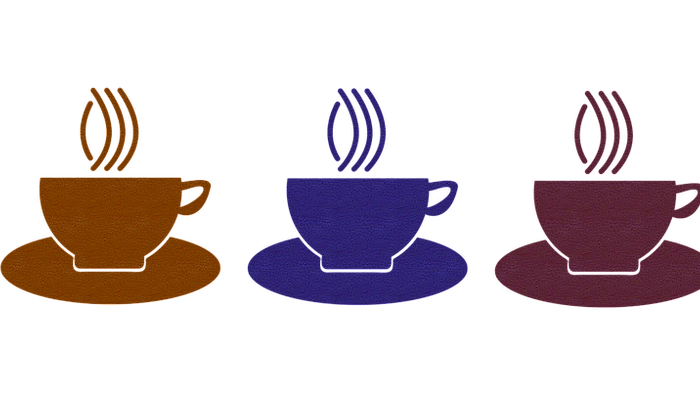 Fire farvefulde tekanoner på sort baggrund