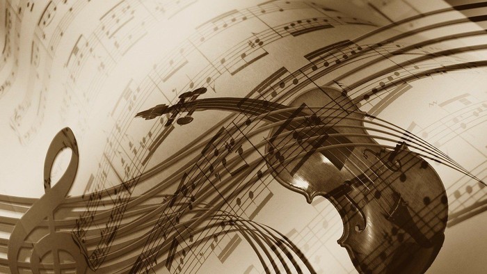 Et violin og noter på musikpapir