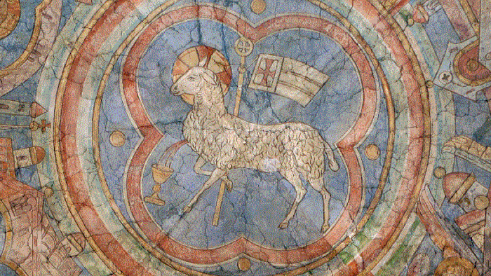 Das Bild zeigt eine detaillierte Darstellung eines Lamm-Mosaiks in einem kreisförmigen Rahmen