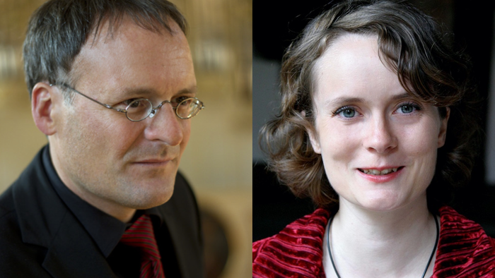 Ein Mann mit Brille und eine Frau mit rotem Oberteil.