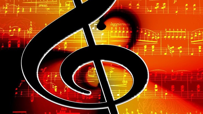 Billedet viser en stor, sort musiknote på baggrund af musiknoter i røde og gule farver