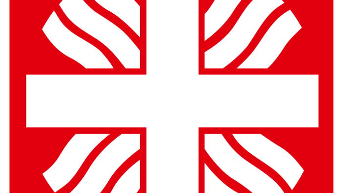 Das Logo zeigt ein weißes Kreuz auf rotem Hintergrund mit dem Wort „caritas“ darunter