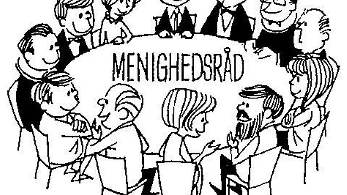 En gruppe af mennesker sidder i en kreds og diskuterer.