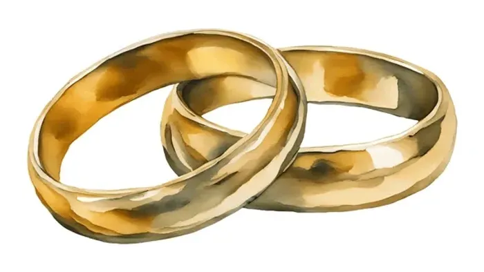 Zwei goldene Ringe liegen übereinander