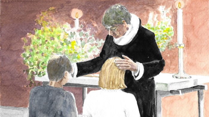 En præst udfører en ritual på et barn i en kirke.