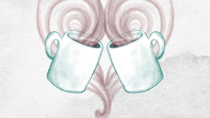 To mugs i form af et hjerte med damp.