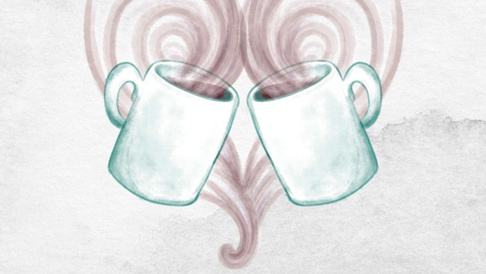 To mugs i form af et hjerte med damp.