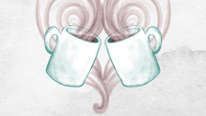 To mugs i form af et hjerte med damp.