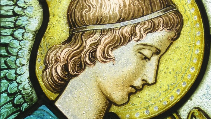 Engel mit Heiligenschein und Schriftrolle