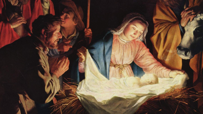 En maleri af Jesus' fødsel med Maria, Josef og hirddyr.