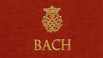 Ein rotes Buch mit goldenem Bach-Wappen und dem Namen "Bach" in Gold.